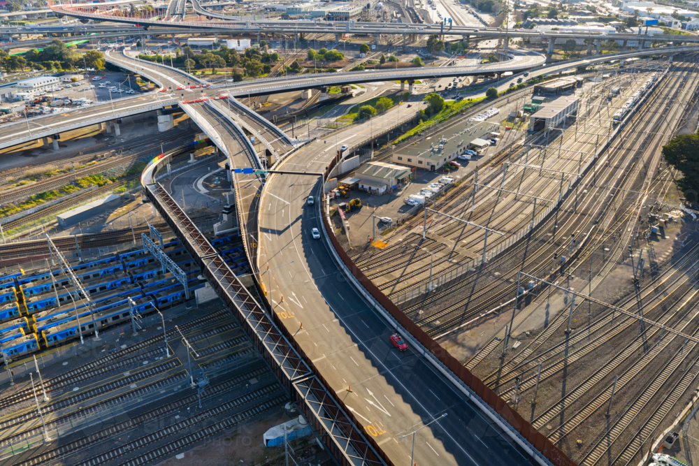 Freways With Rails Image of Aerial view of winding freeways over urban railway yards ...