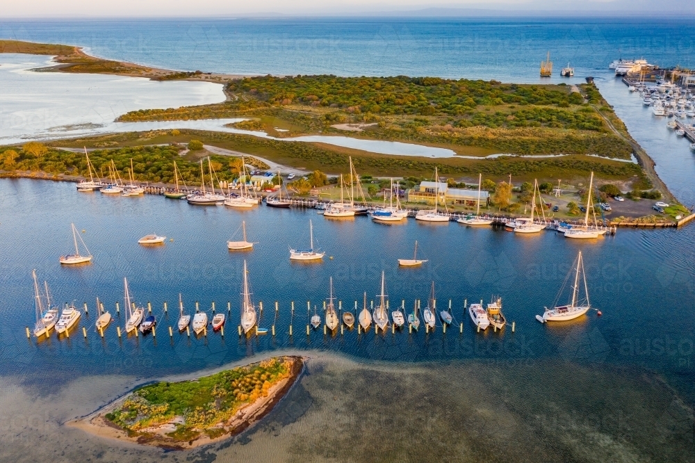 Aerial view of yachts moored in a marina - Australian Stock Image