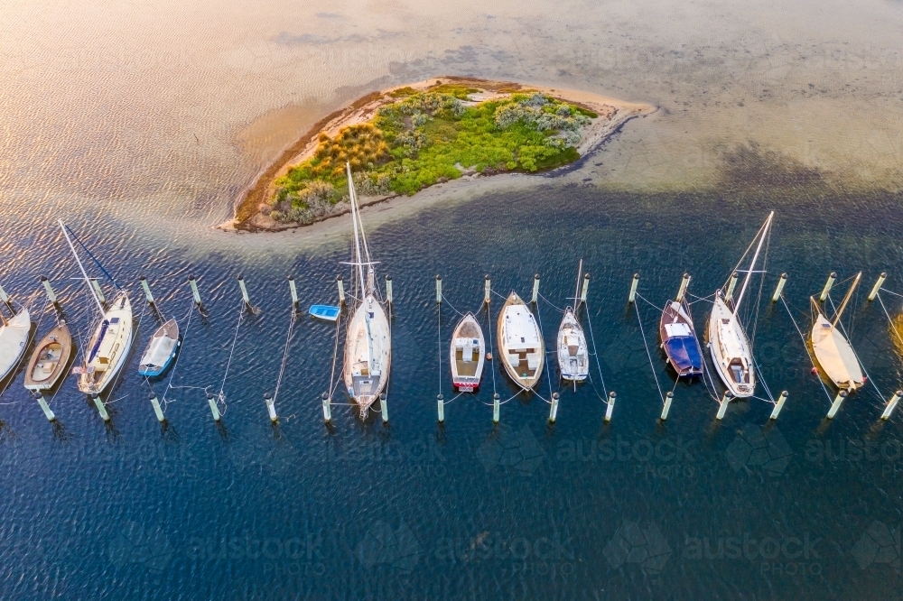 Aerial view of yachts moored near a small island - Australian Stock Image