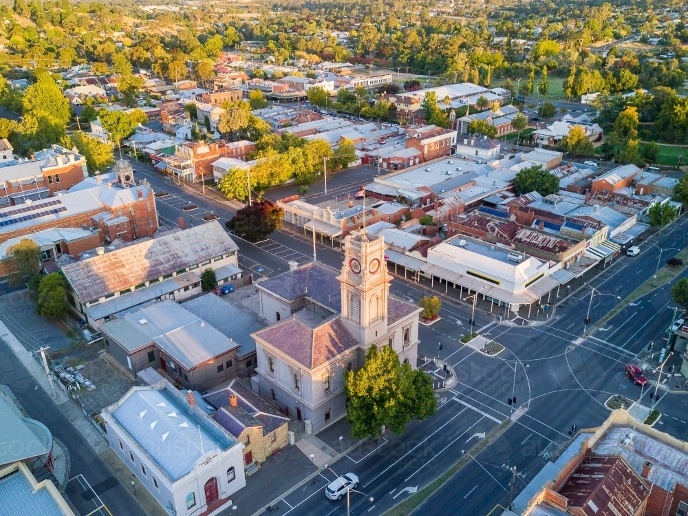 Aerial view over buildings and roads running through a country town - Australian Stock Image