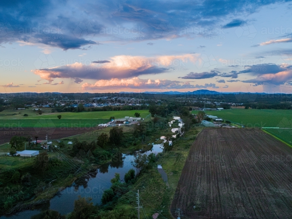 Aerial view over Hunter river with rain on horizon   - Australian Stock Image