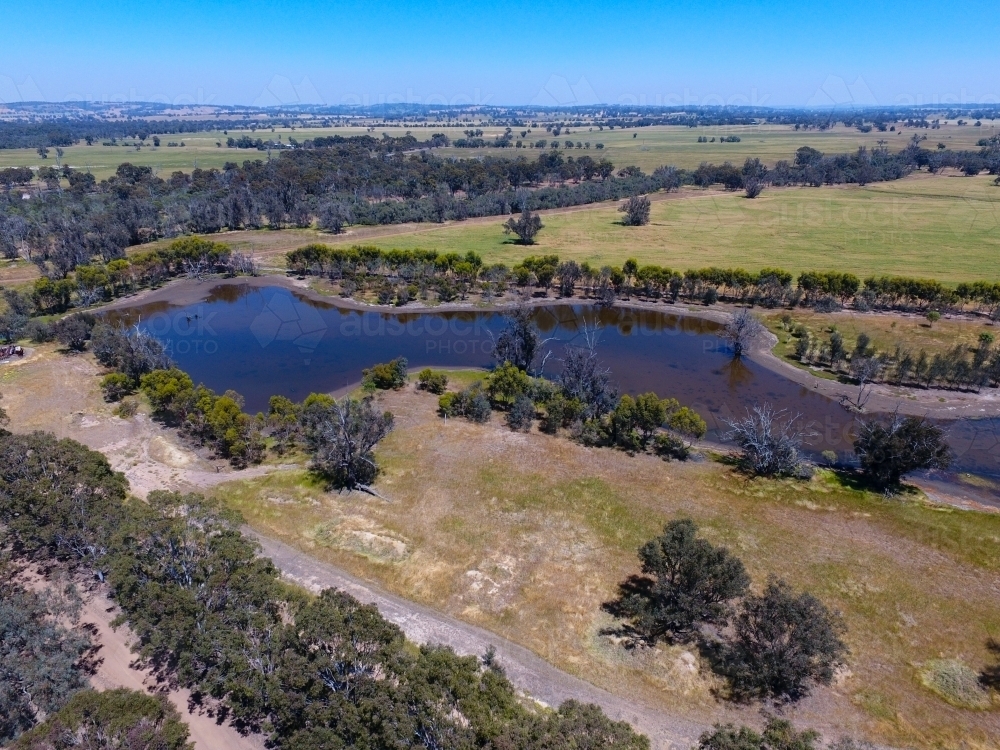 Aerial view over landscape with waterhole in river - Australian Stock Image