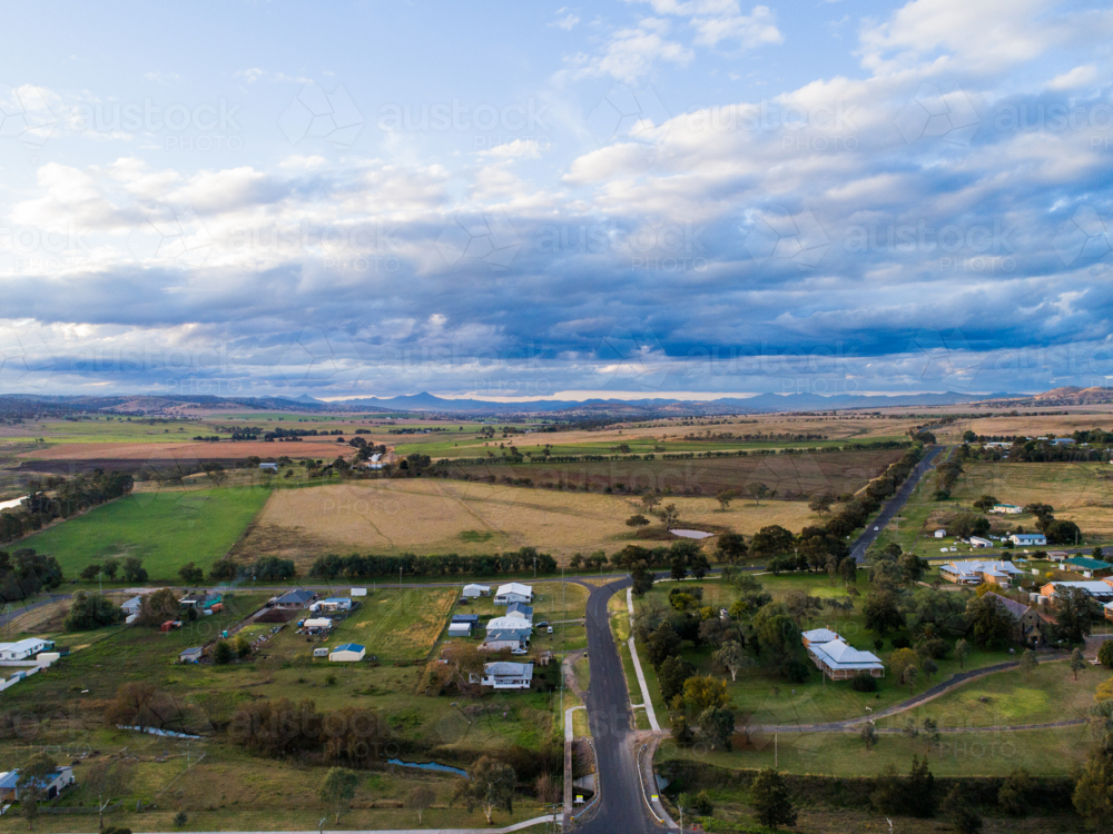 Aerial view road leading out of the country town of Merriwa in New South Wales Australia - Australian Stock Image