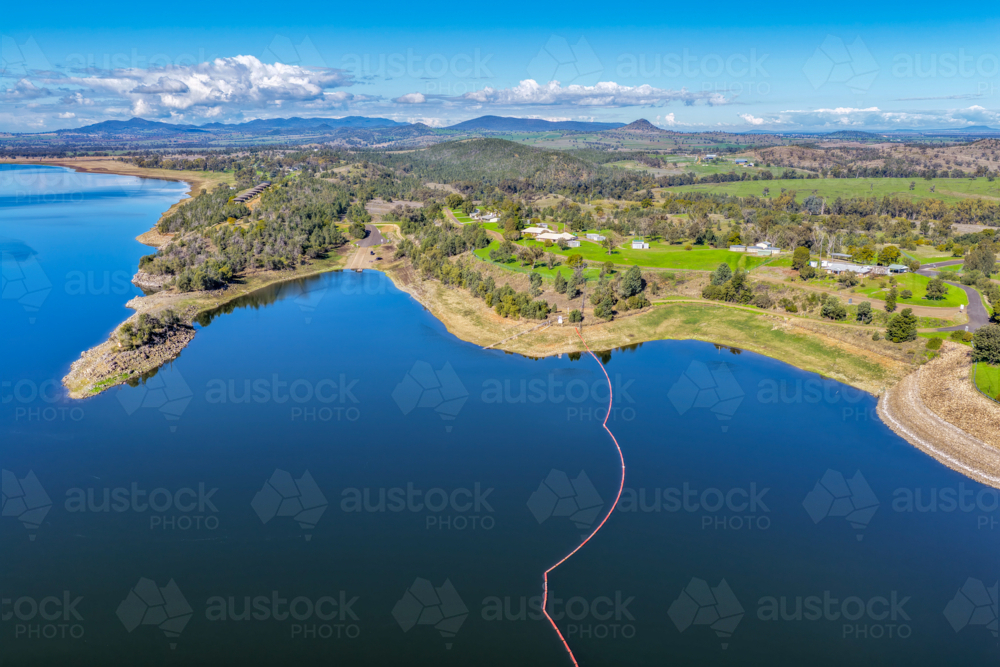 Aerial view showcasing the Lake Keepit boat ramp, shoreline and surrounding landscape - Australian Stock Image