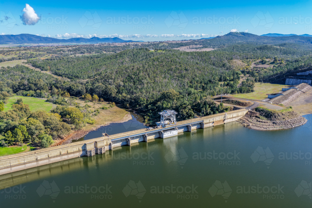 Aerial view showcasing the Lake Keepit dam wall and surrounding rural landscape - Australian Stock Image