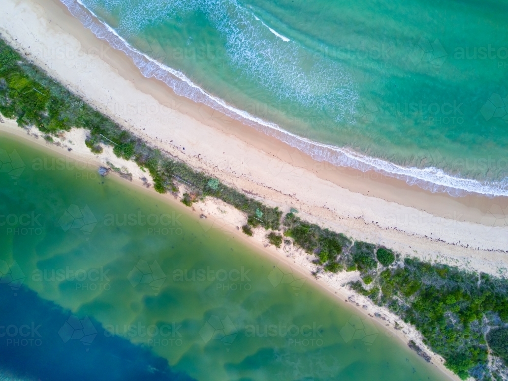 Aerial views a thin sliver of sand divides the two bodies of water - Australian Stock Image