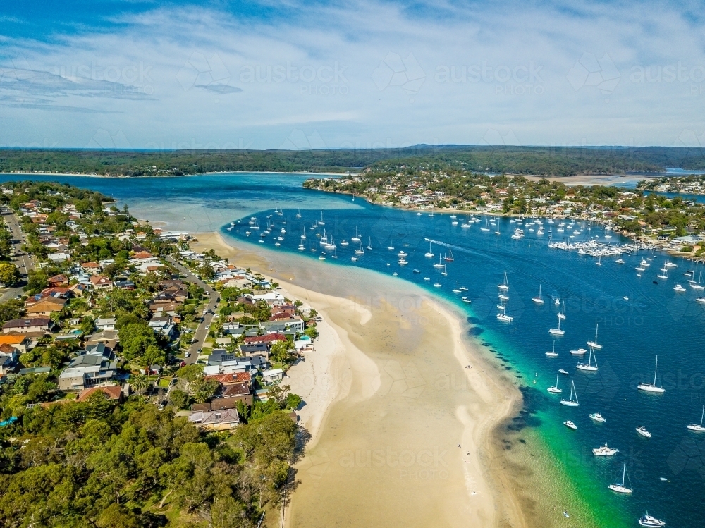 Aerial views of Gunnamatta beach and water views with the many luxury yachts and boats moored - Australian Stock Image