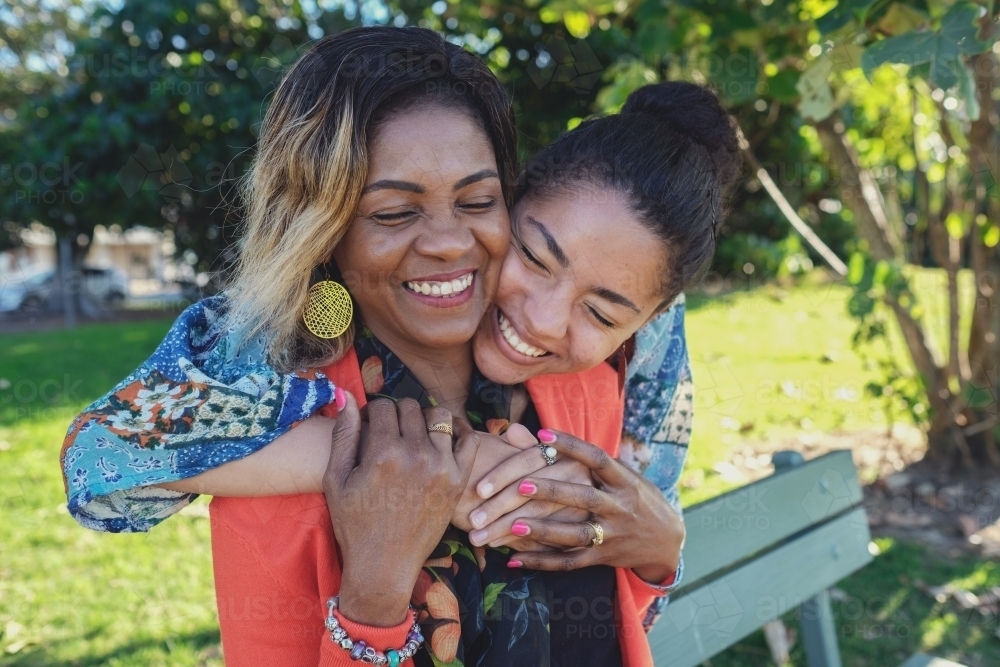 African mother and multicultural teen daughter - Australian Stock Image