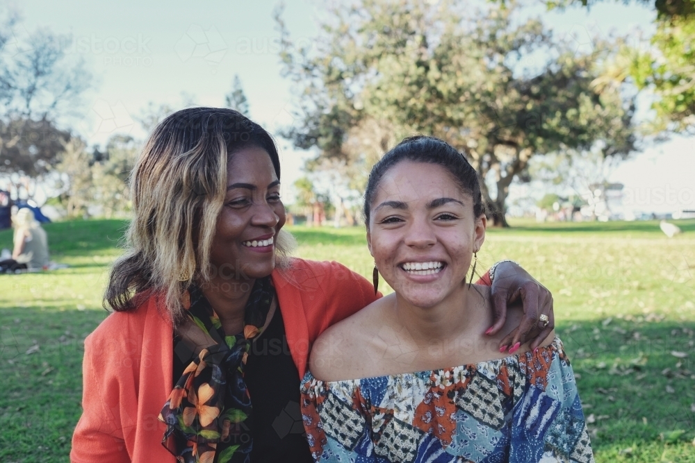 African mother and multicultural teen daughter together - Australian Stock Image