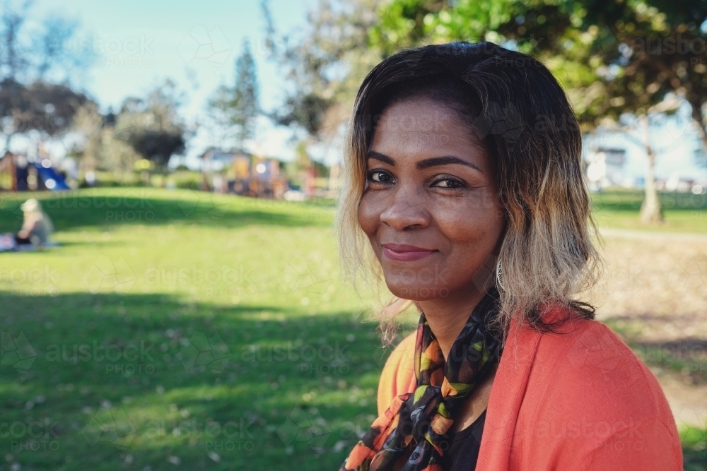 African woman in the park - Australian Stock Image