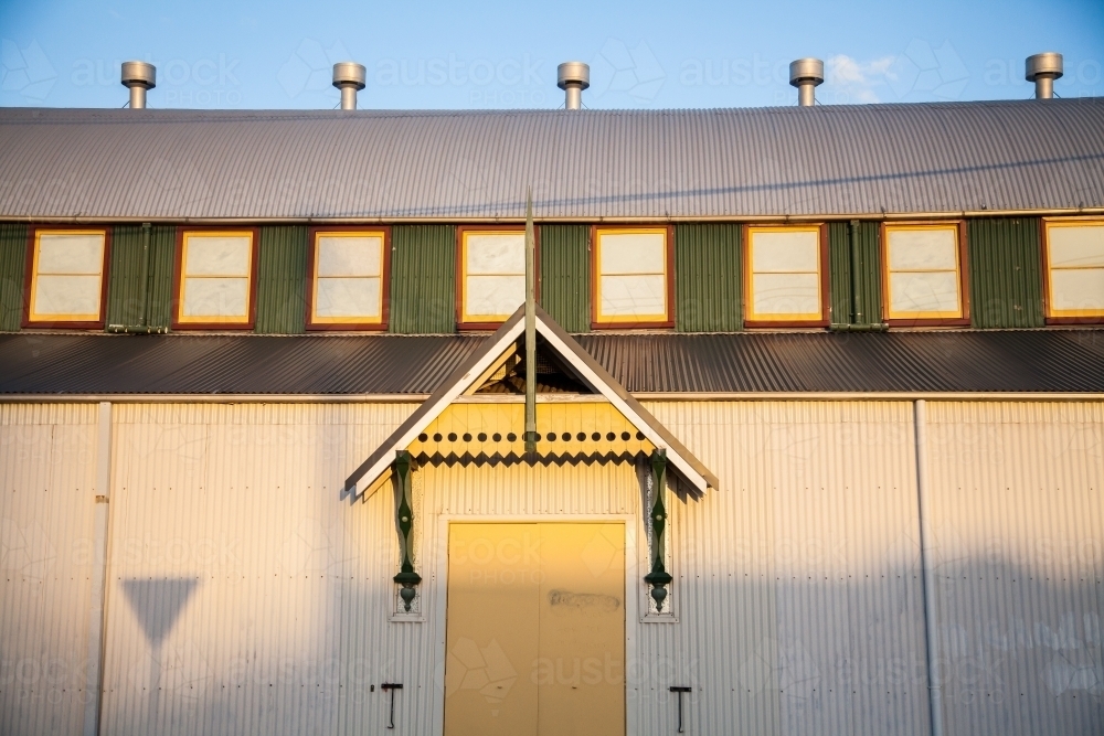 Afternoon light and shadows on showground building in Singleton - Australian Stock Image