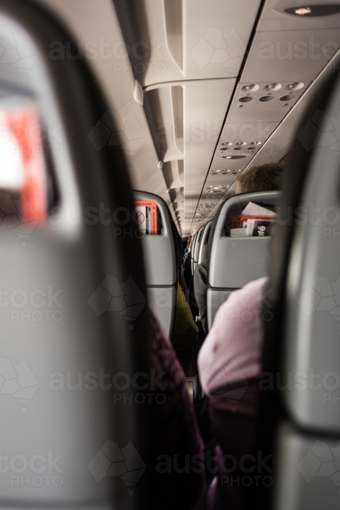 Airplane interior, looking through the seats - Australian Stock Image