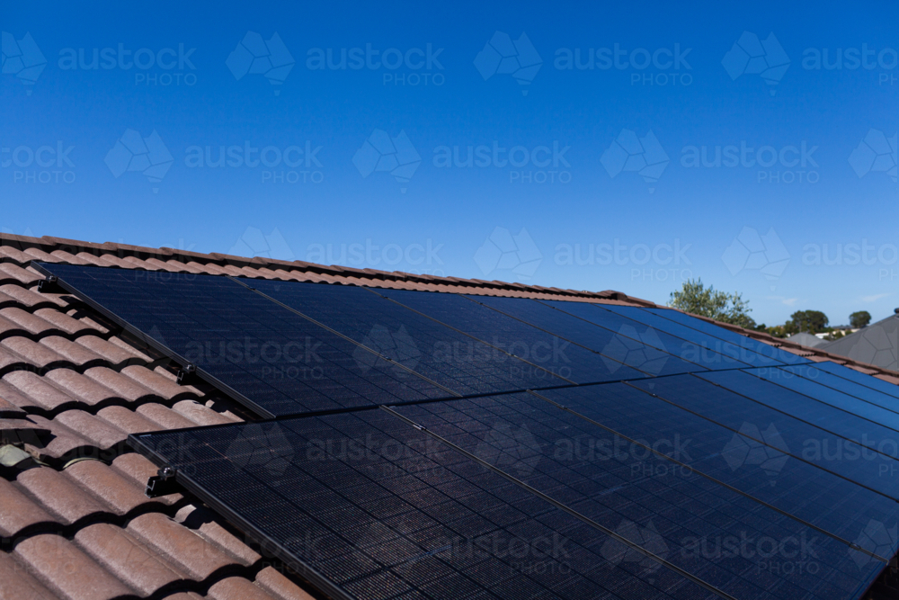 All black bi-facial solar panels installed on Australian roof - Australian Stock Image