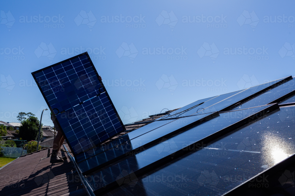All Black bifacial solar panels on roof ready to be installed and connected to power system - Australian Stock Image