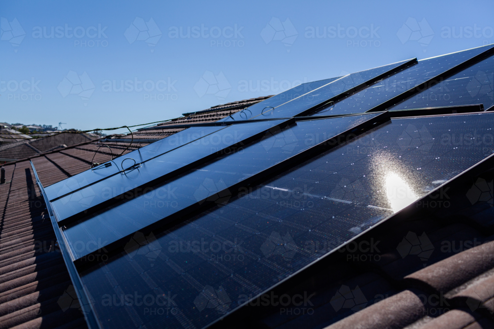 All Black bifacial solar panels on roof ready to be installed and connected to power system - Australian Stock Image
