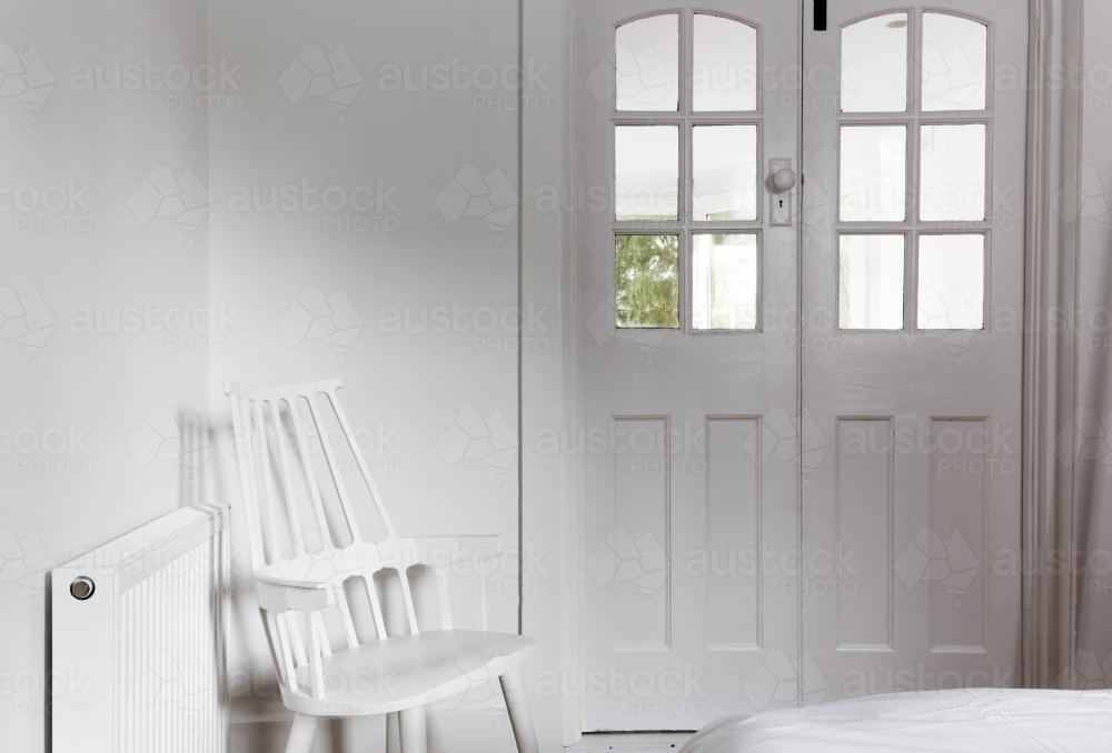 All white interior and decor in a bedroom - Australian Stock Image