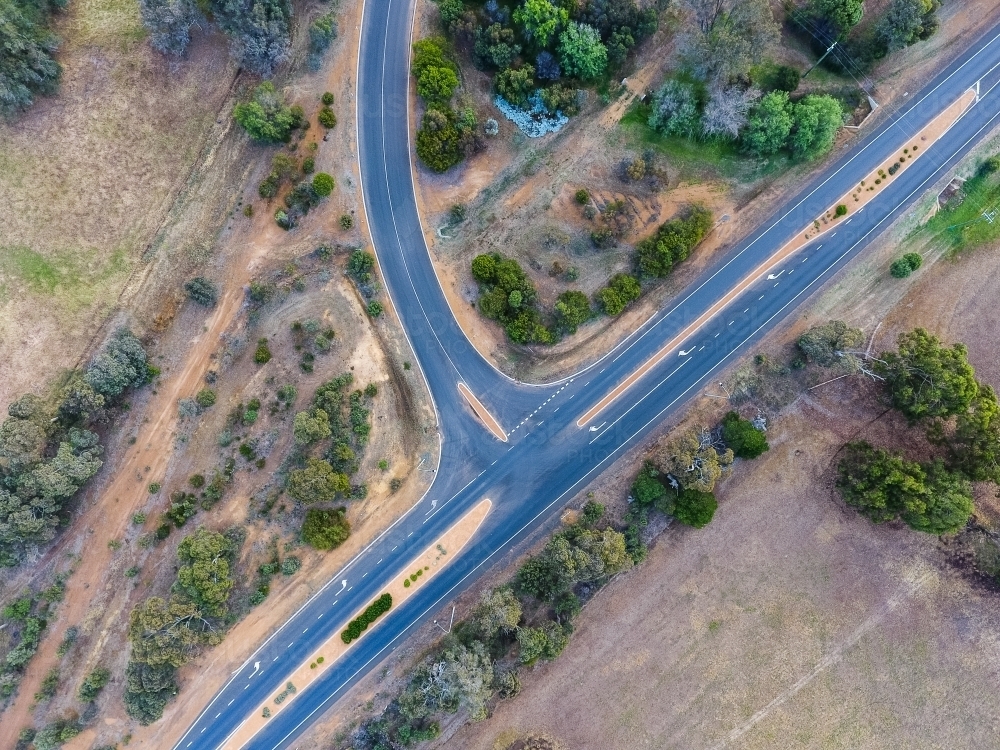 Image of altered interection showing side road joining highway at t