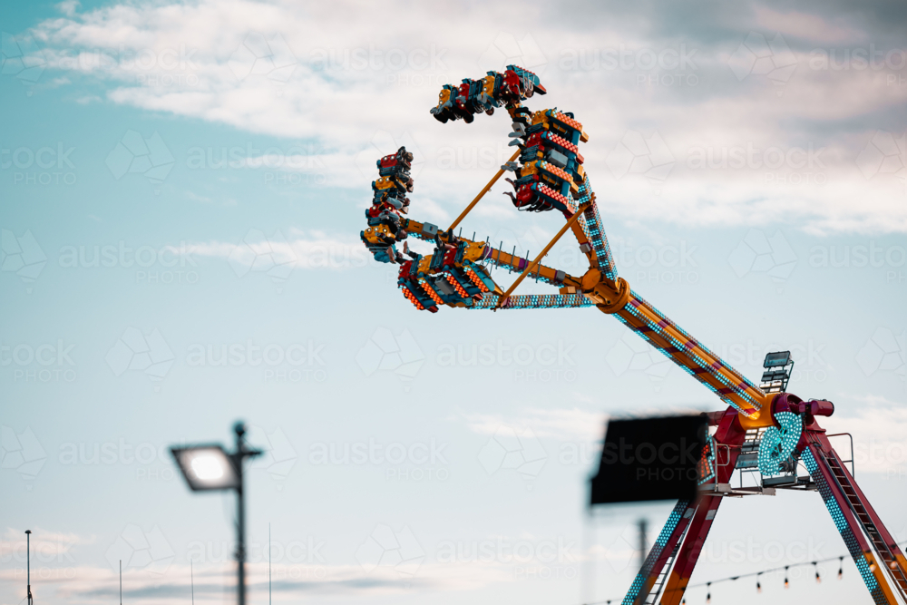 Free Moving Rides Image of Amusement ride in motion at the carnival - Austockphoto