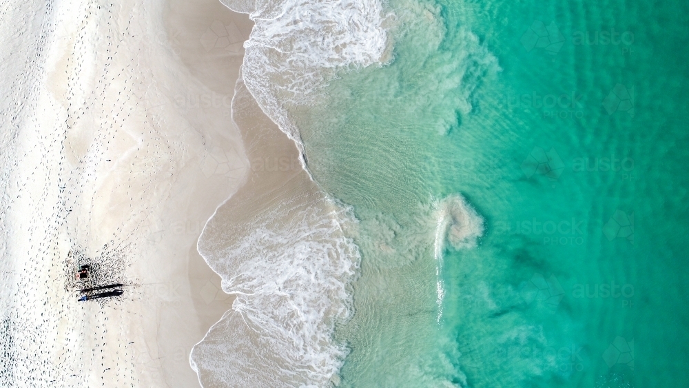 An aerial shot of a fisherman trying his luck in the ocean - Australian Stock Image