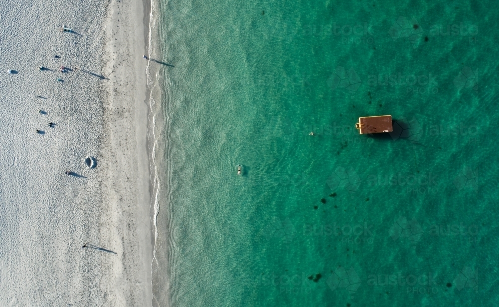 An aerial view of people walking on a beach - Australian Stock Image