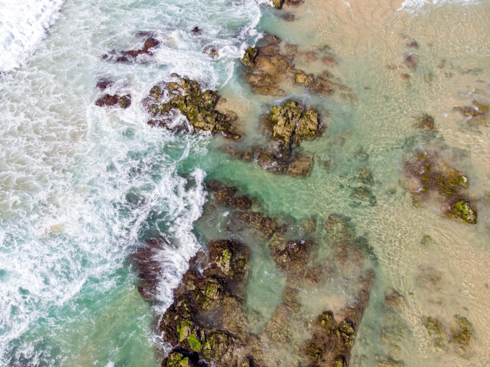 An aerial view of the coastline sea and sand on Cabarita Beach at Hastings Point in New South Wales - Australian Stock Image
