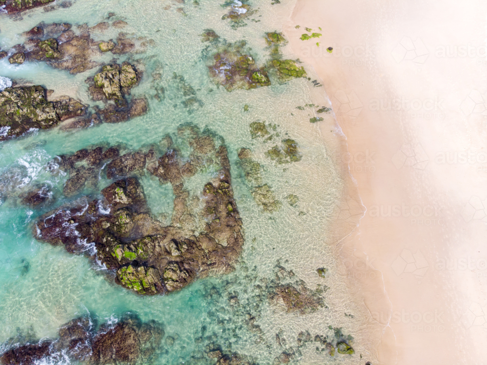 An aerial view of the coastline sea and sand on Cabarita Beach at Hastings Point in New South Wales - Australian Stock Image
