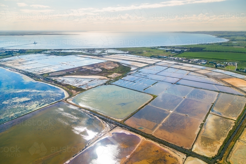 An areial view of settling ponds on edge of Corio Bay - Australian Stock Image