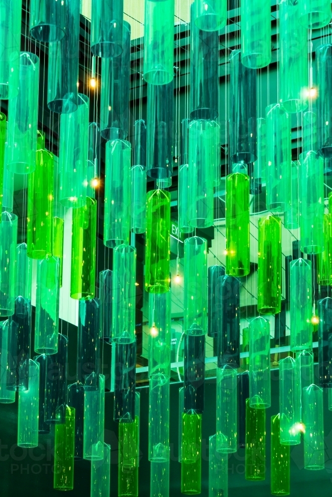 An arrangement of green tubular lights in a ceiling - Australian Stock Image