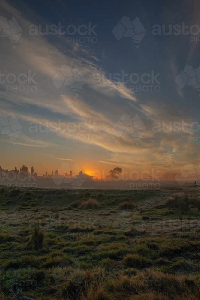 An early misty morning in the country under a cloudy sky - Australian Stock Image
