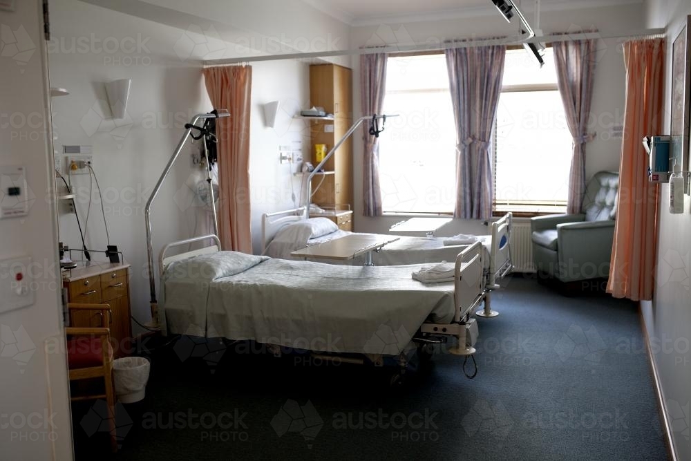 An empty private hospital ward with two single beds - Australian Stock Image