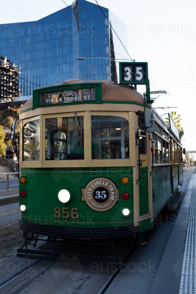 An historic W-Class 1930's green and yellow city circle tram in Melbourne Australia - Australian Stock Image