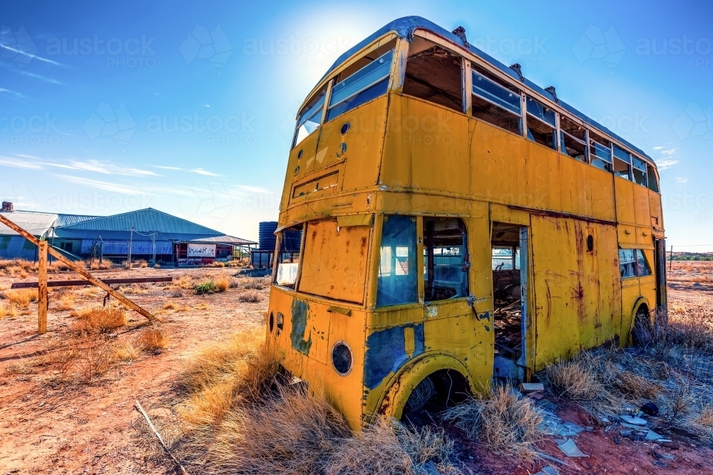 An old dilapidated double decker bus outside the Betoota Hotel - Australian Stock Image