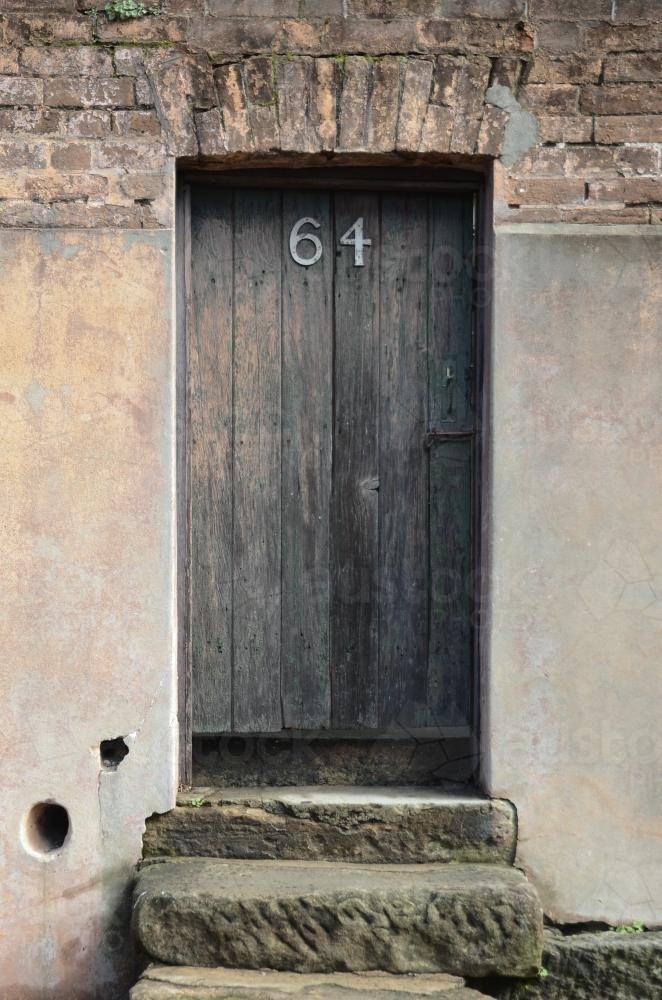 An old door on a sandstone house. - Australian Stock Image