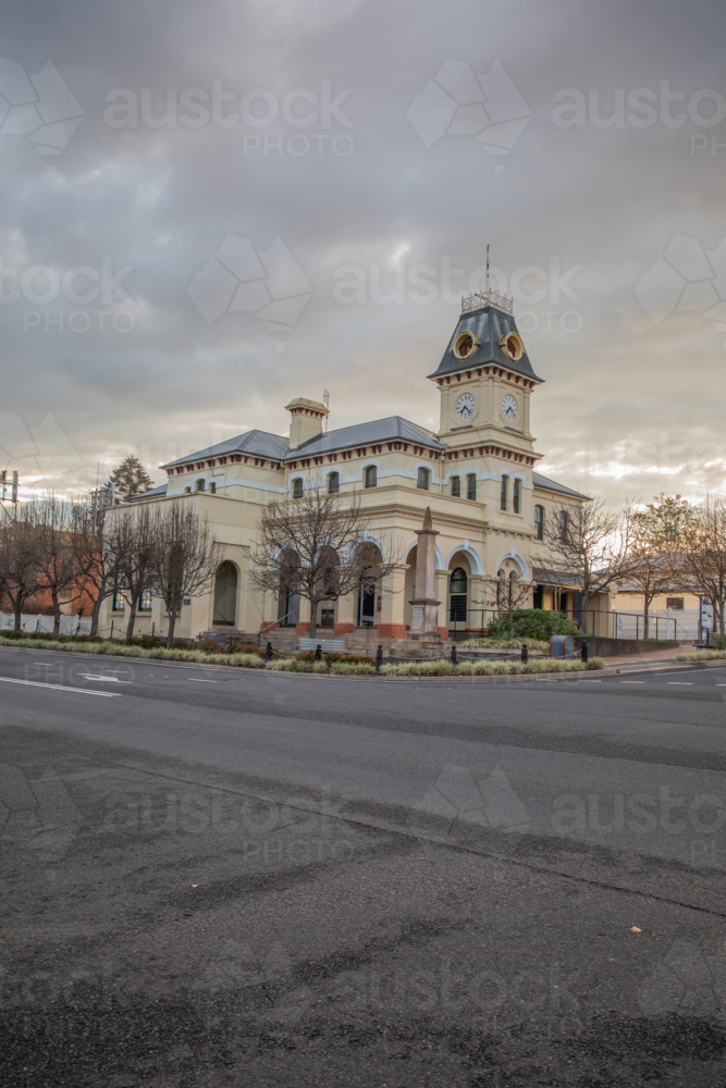 An old town Post Office building with a clock tower under grey skies - Australian Stock Image