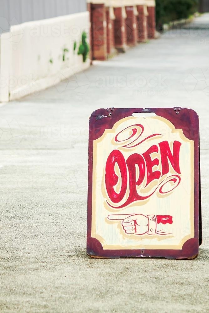 An open sign on the footpath - Australian Stock Image