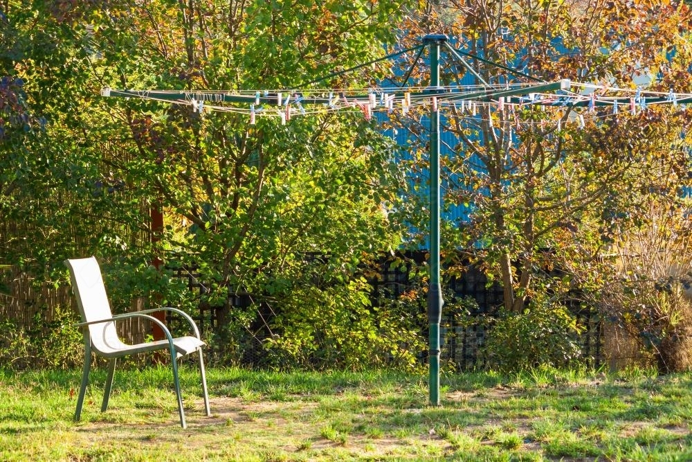 An outdoor chair under a clothes line - Australian Stock Image