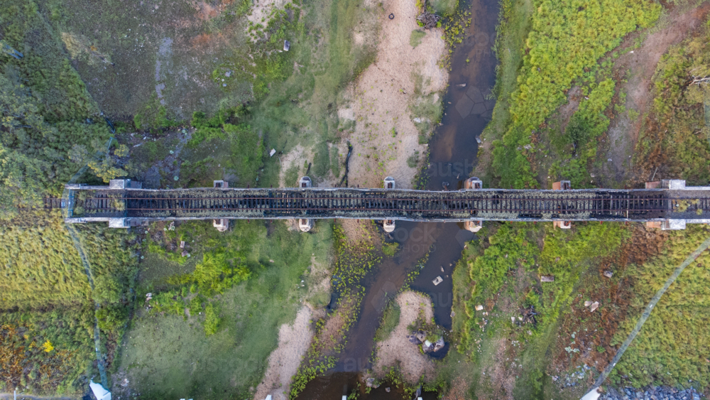 An overhead image of an old railway crossing over a creek - Australian Stock Image