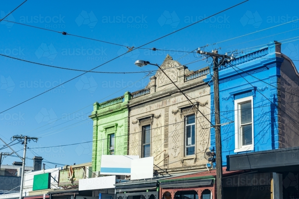 An urban streetscape with old fashioned facades and overhead tram cables - Australian Stock Image