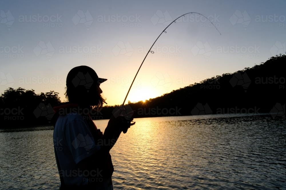 Angler at Sunset - Australian Stock Image