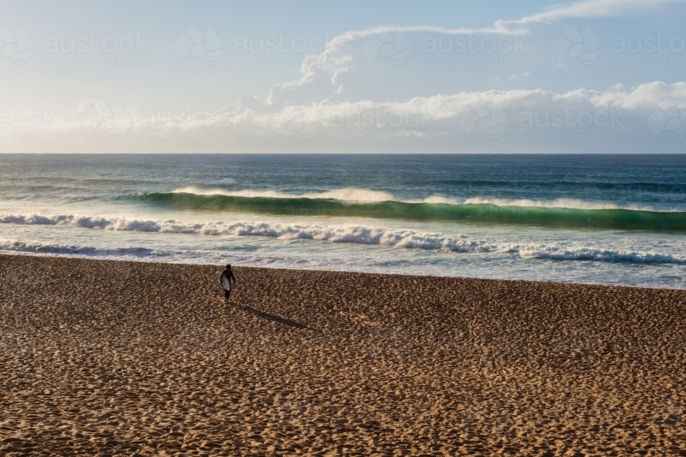 anonymous surfer on the beach - Australian Stock Image