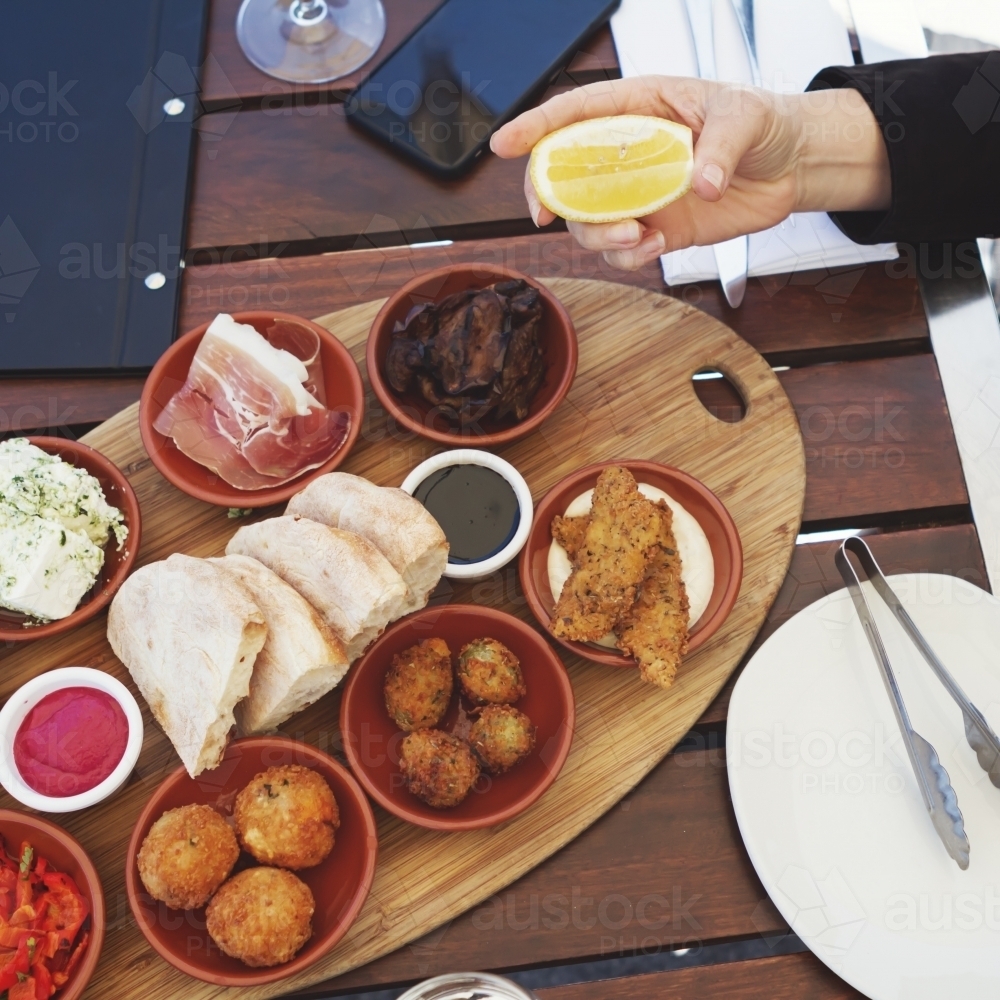 Antipasto platter at a working lunch - Australian Stock Image