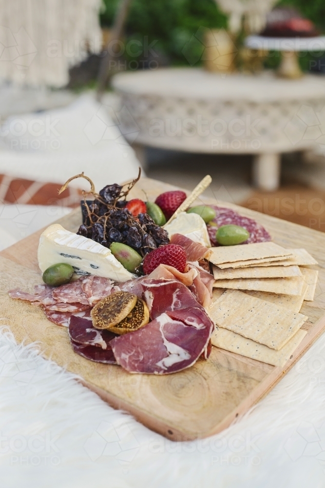 Antipasto platter with boho details in the background - Australian Stock Image