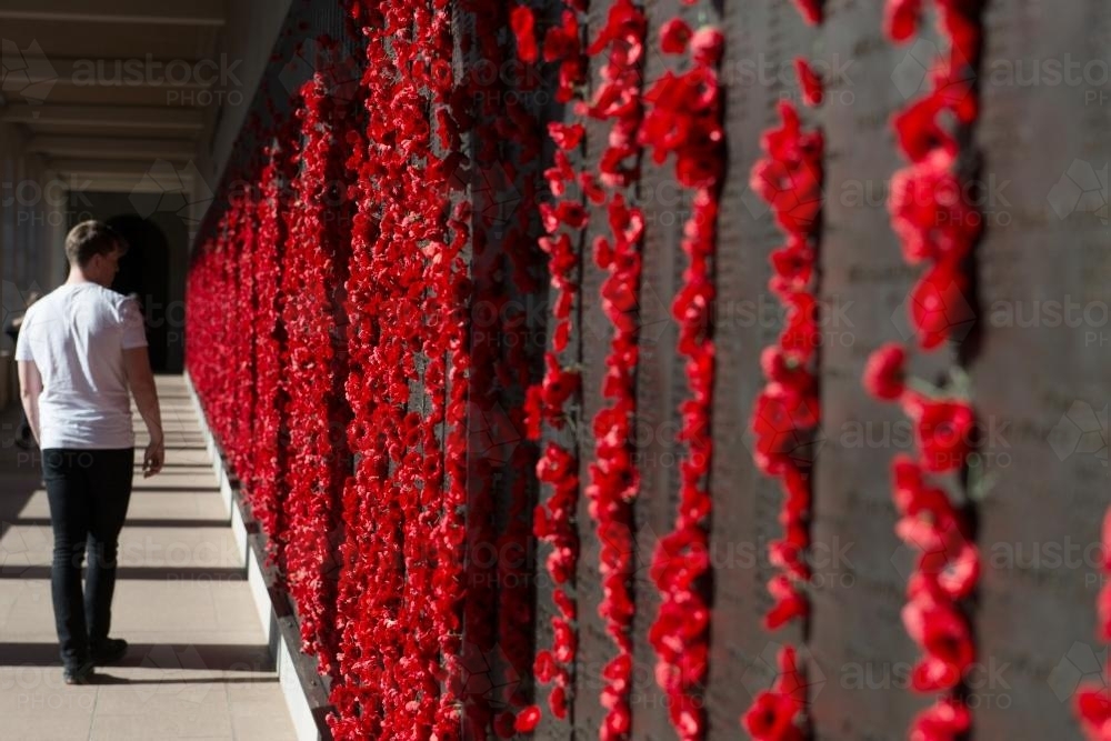 ANZAC DAY at the Australian War Memorial man walking along wall - Australian Stock Image