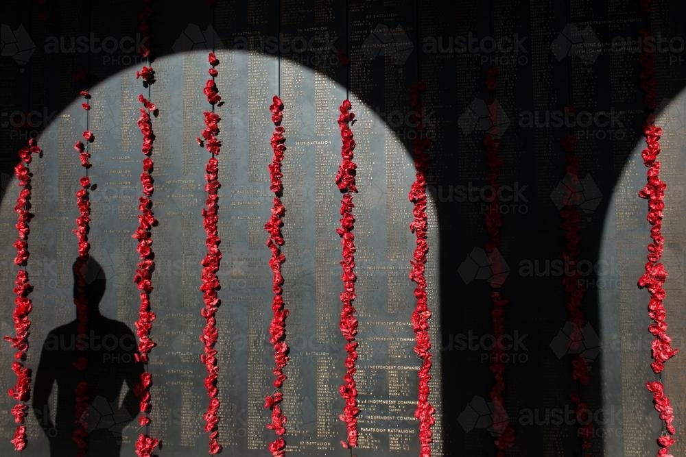 ANZAC DAY at the Australian War Memorial shadow of a man looking at the wall - Australian Stock Image