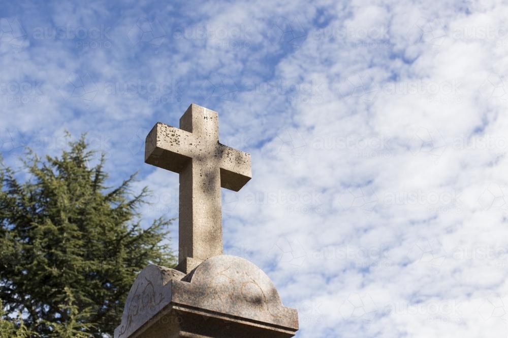 ANZAC Memorial Cross against blue cloudy sky - Australian Stock Image