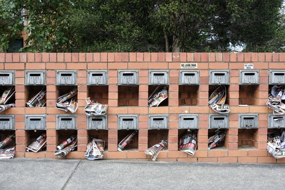 Apartment letterboxes containing junk mail - Australian Stock Image