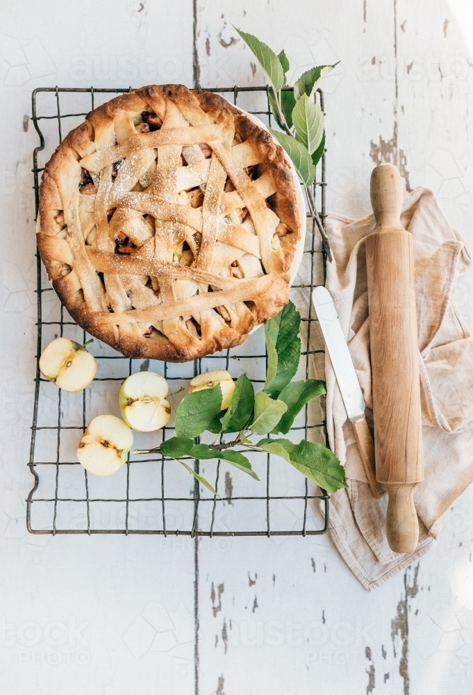 Apple pie cooling on a rack from above. - Australian Stock Image