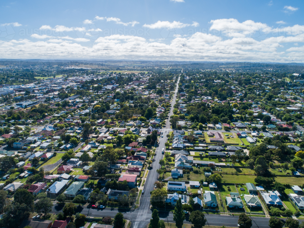 Armidale aerial streetscape in bright sunlight with houses lining roads through rural city - Australian Stock Image