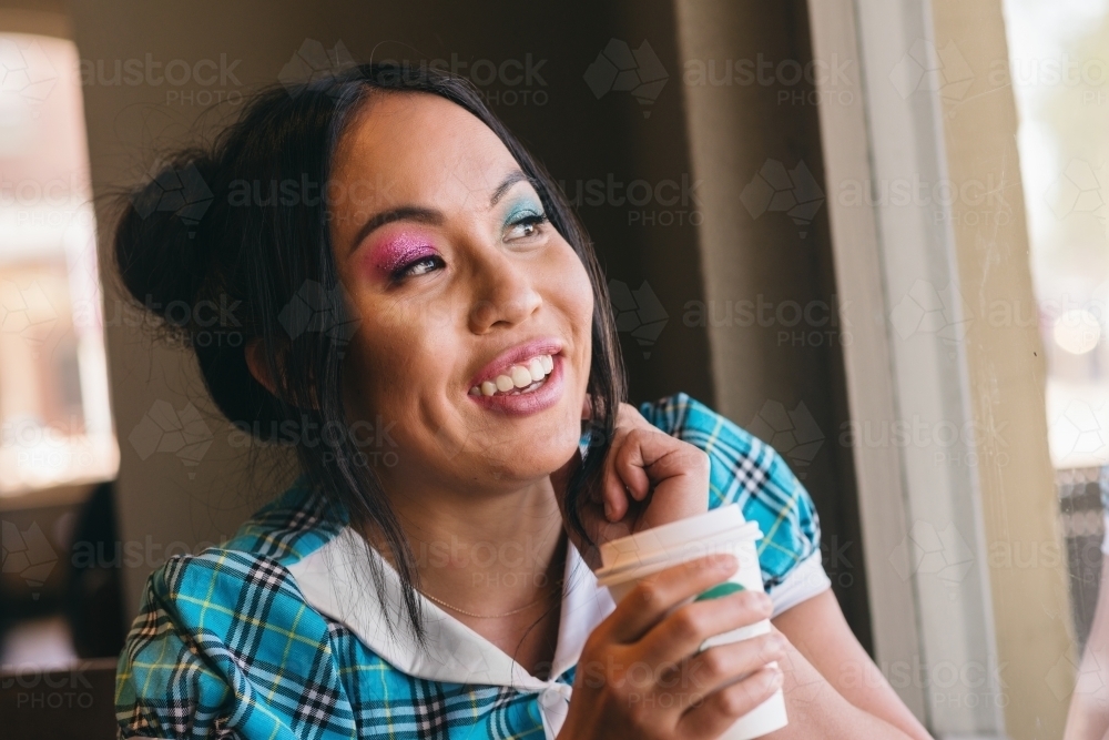 asian woman with coffee - Australian Stock Image