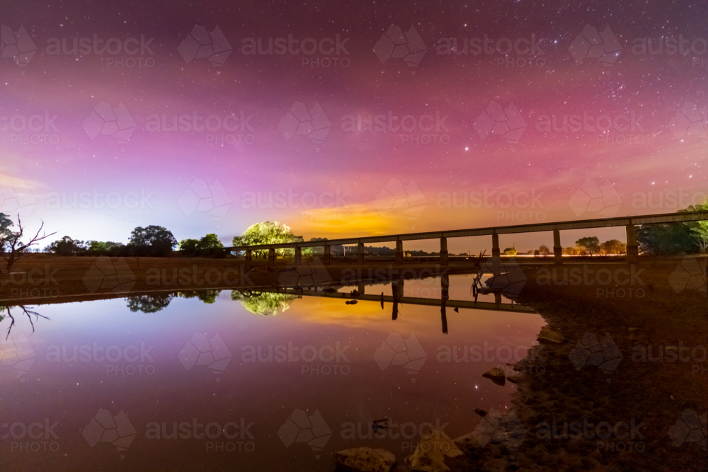 Aurora Australis colours in the sky over a viaduct bridge at Joyces Creek in Central Victoria - Australian Stock Image